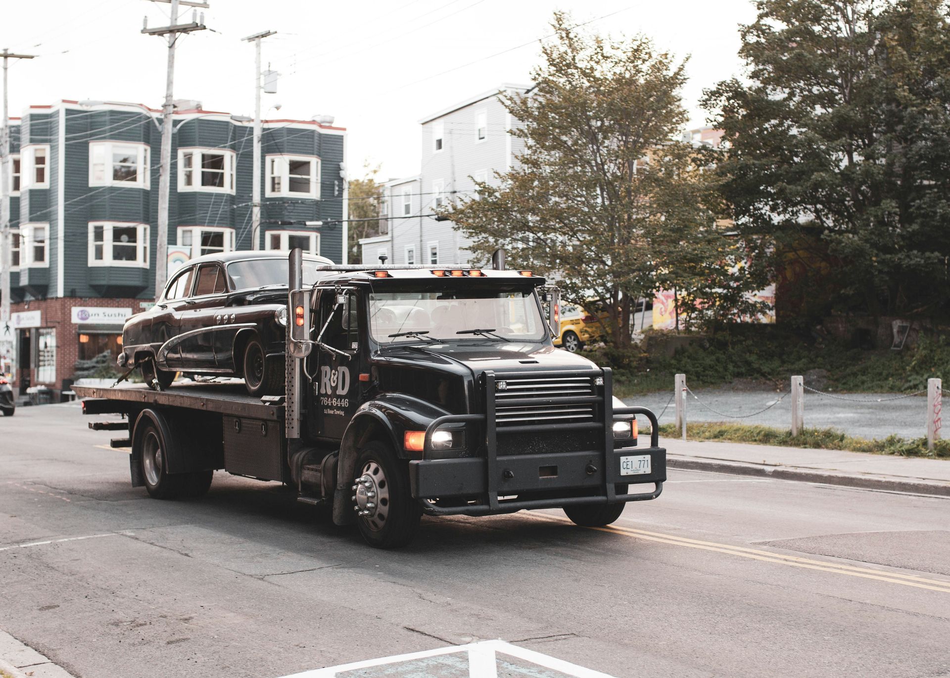 black truck on road during daytime